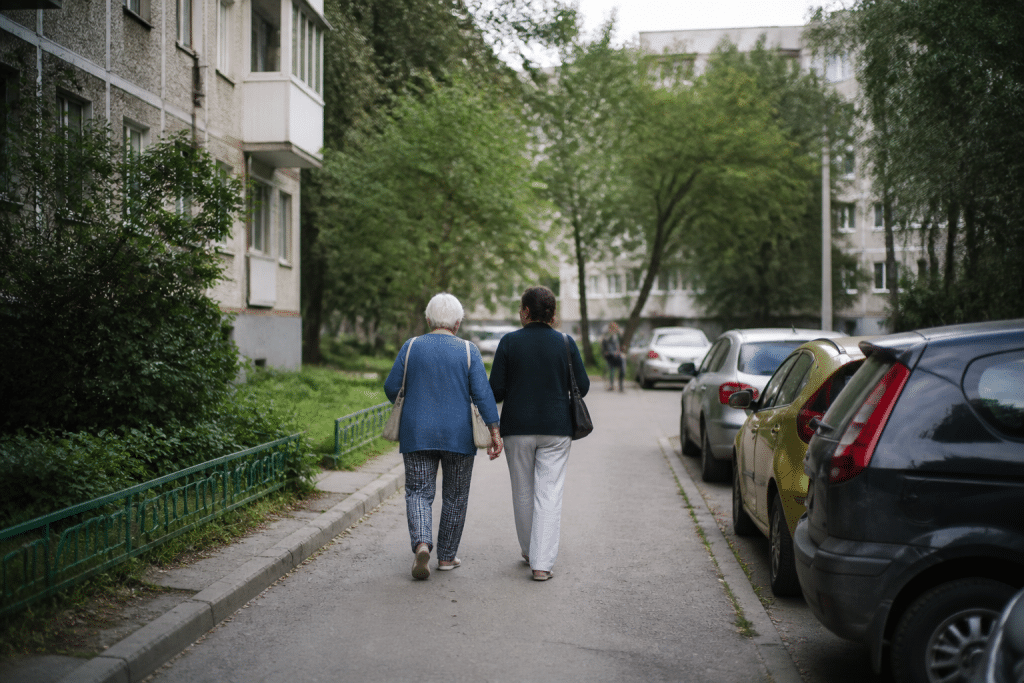 Residents walking in quiet residential street with apartment buildings